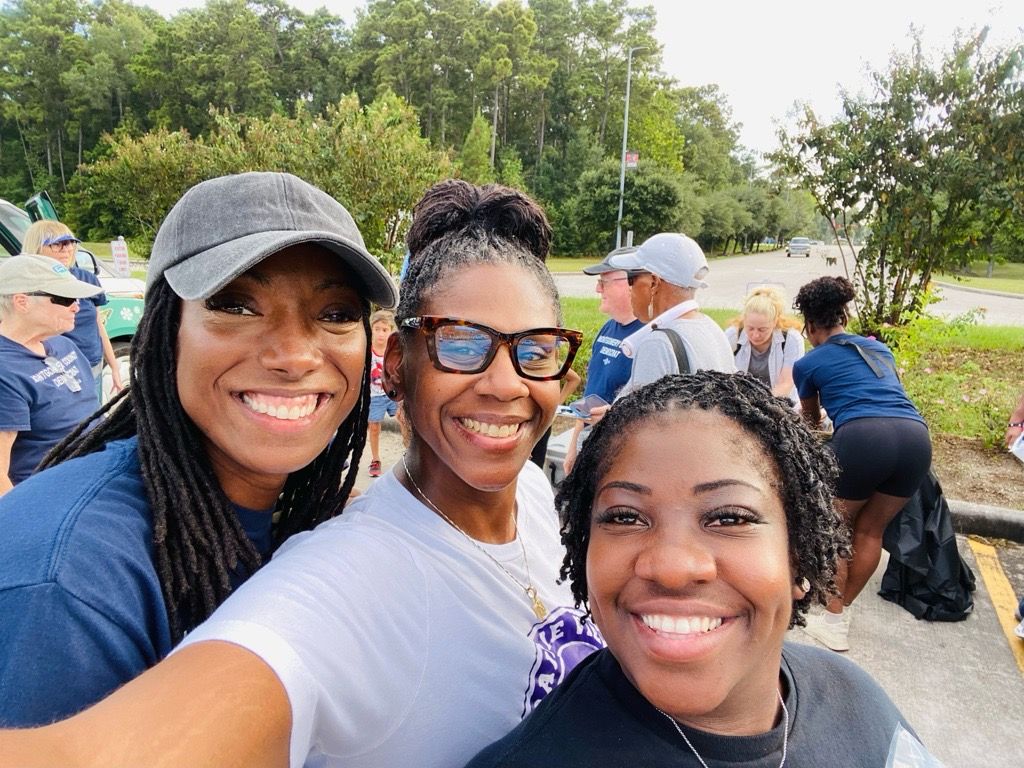 Nicole King with community members during a cleanup activity